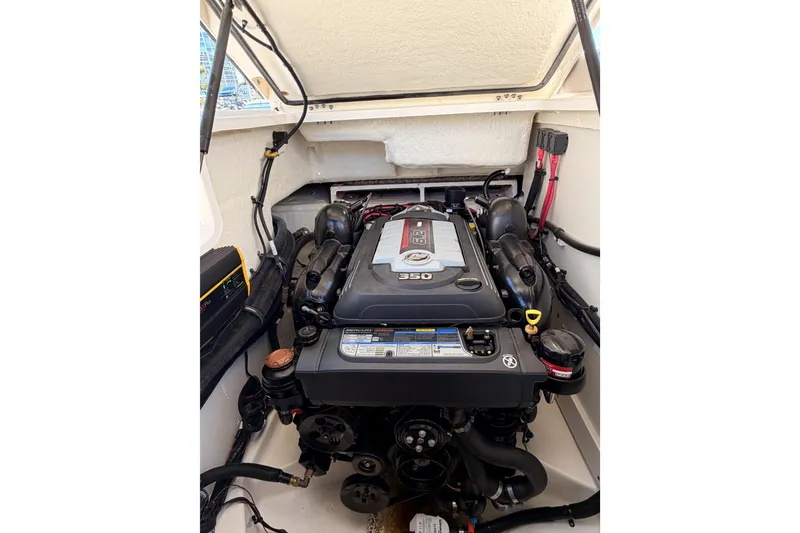 Slide: The Image of 2024 Sea Ray SLX 260 engine compartment showcasing powerful 350 horsepower engine. - 45