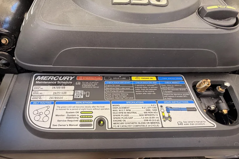Slide: The Image of 2024 Sea Ray SLX 260 engine maintenance schedule and specifications label. - 48