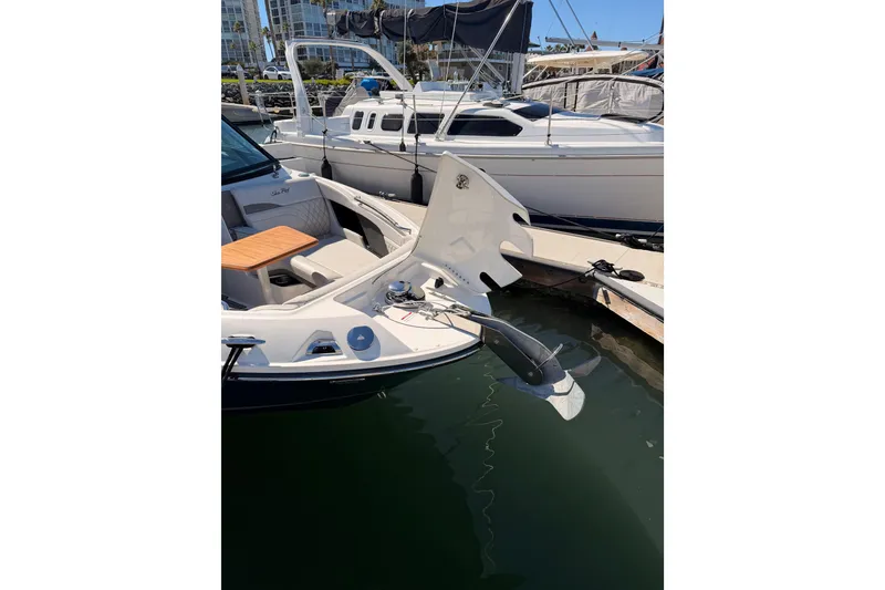 Slide: The Image of 2024 Sea Ray SLX 260 boat docked, showcasing sleek design and modern features. - 61