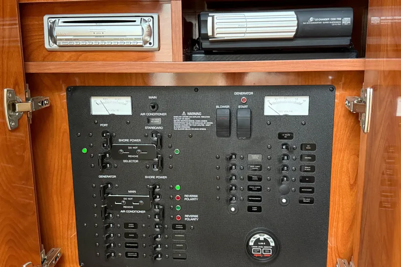 Slide: The Image of Electrical control panel in a 2005 Rinker Fiesta Vee 300 boat cabin. - 21