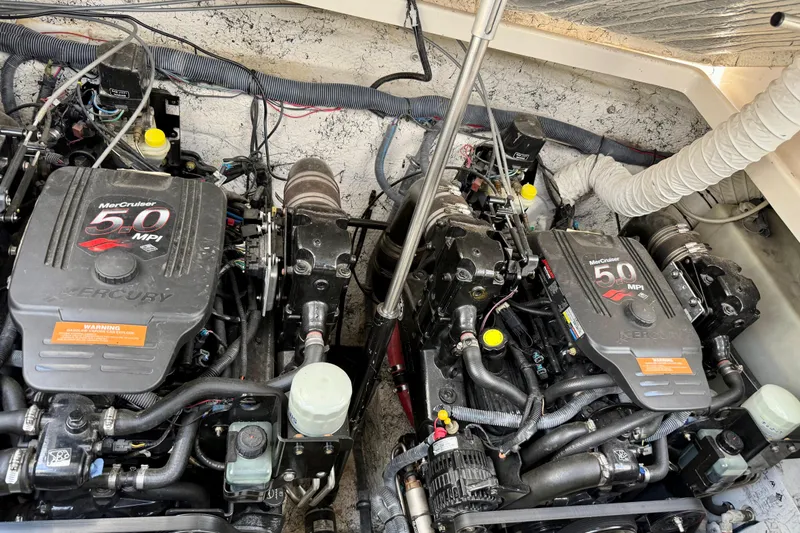 Slide: The Image of Engine compartment of a 2005 Rinker Fiesta Vee 300 with twin MerCruiser 5.0 MPI engines. - 25