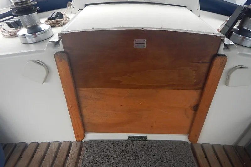 Slide: The Image of 1978 Pearson 424 sailboat cockpit with wooden hatch and winches. - 10