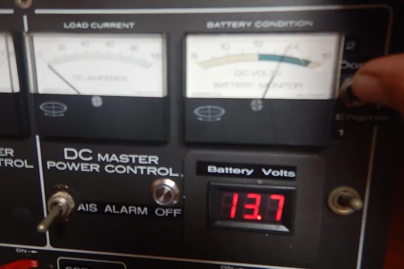 Slide: The Image of DC power control panel with battery voltage display reading 13.7 volts, Pearson 424, 1978. - 15