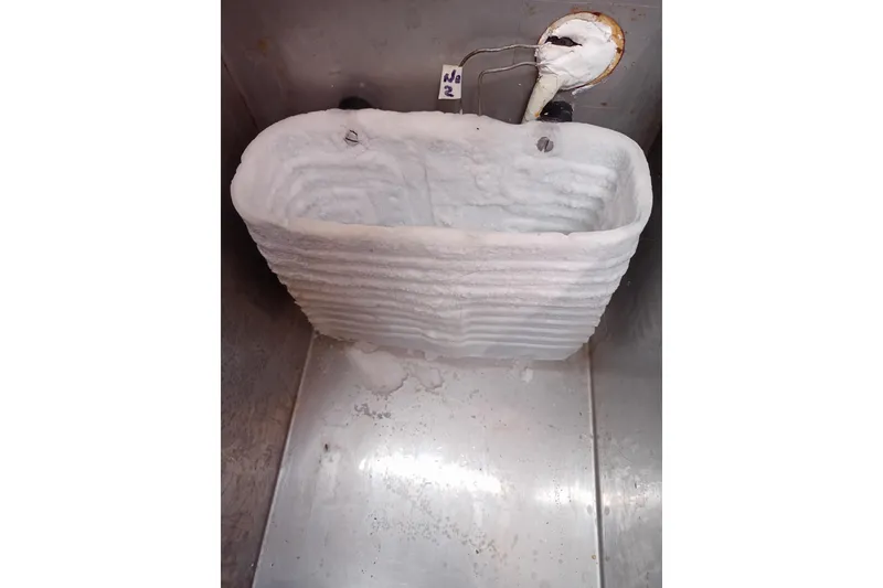 Slide: The Image of Frozen ice buildup in a Pearson 424 boat freezer, 1978 model. - 17