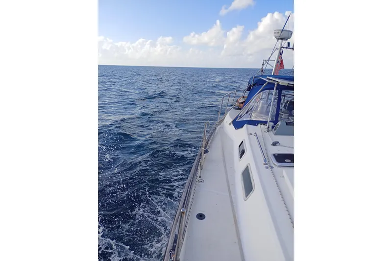 Slide: The Image of Sailing on a 1978 Pearson 424 yacht in open ocean under a clear blue sky. - 4