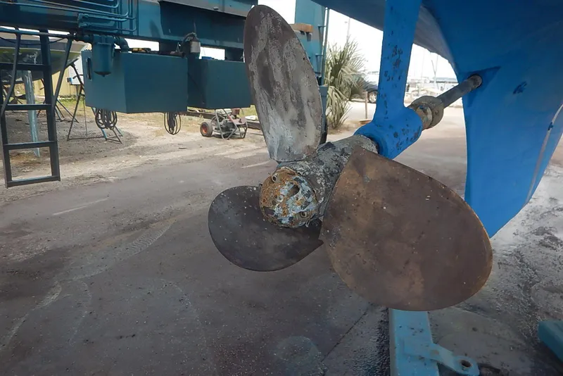 Slide: The Image of Propeller of a 1978 Pearson 424 sailboat in a shipyard setting. - 9