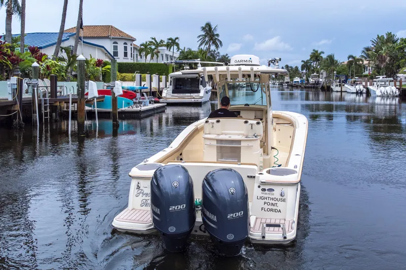 Slide: The Image of 2015 Scout 275 LXF boat navigating a canal in Lighthouse Point, Florida. - 12