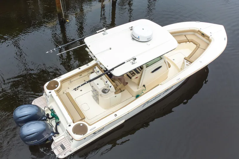 Slide: The Image of 2015 Scout 275 LXF boat with dual engines on calm water. - 20