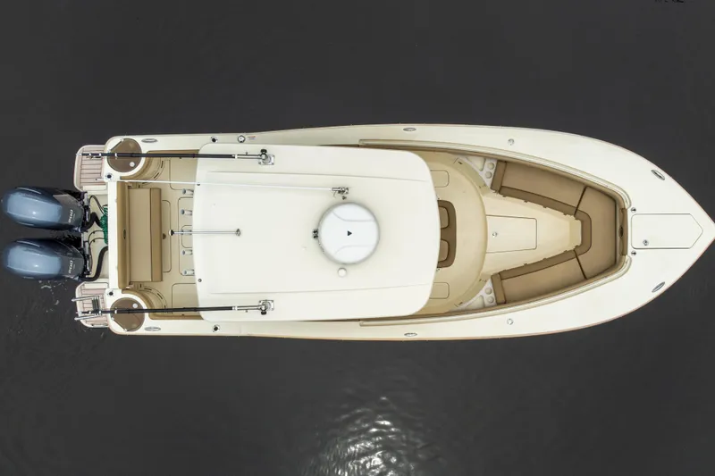 Slide: The Image of Overhead view of 2015 Scout 275 LXF boat with dual engines on water. - 21