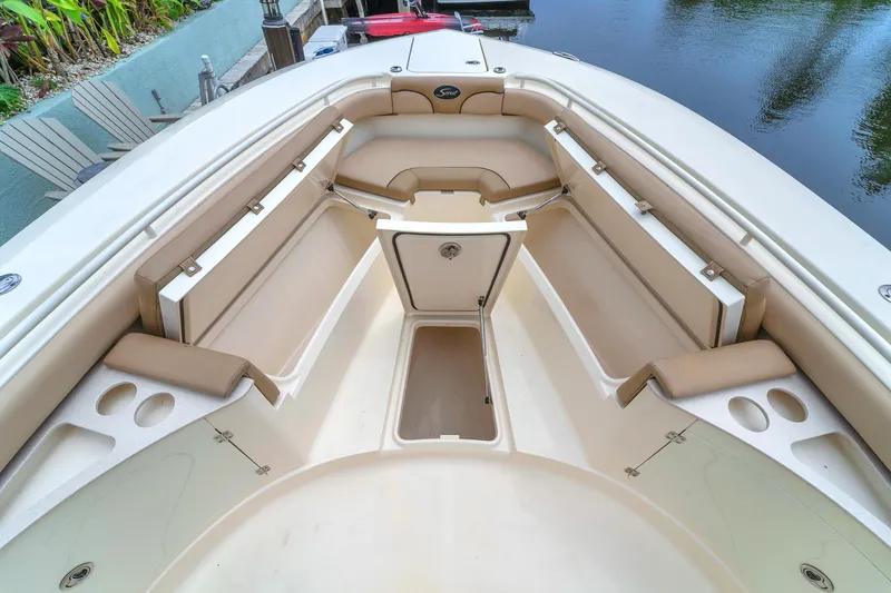 Slide: The Image of 2015 Scout 275 LXF boat interior with seating and storage compartments. - 35