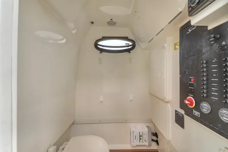 Slide: The Image of 2015 Scout 275 LXF boat interior with control panel and porthole. - 37