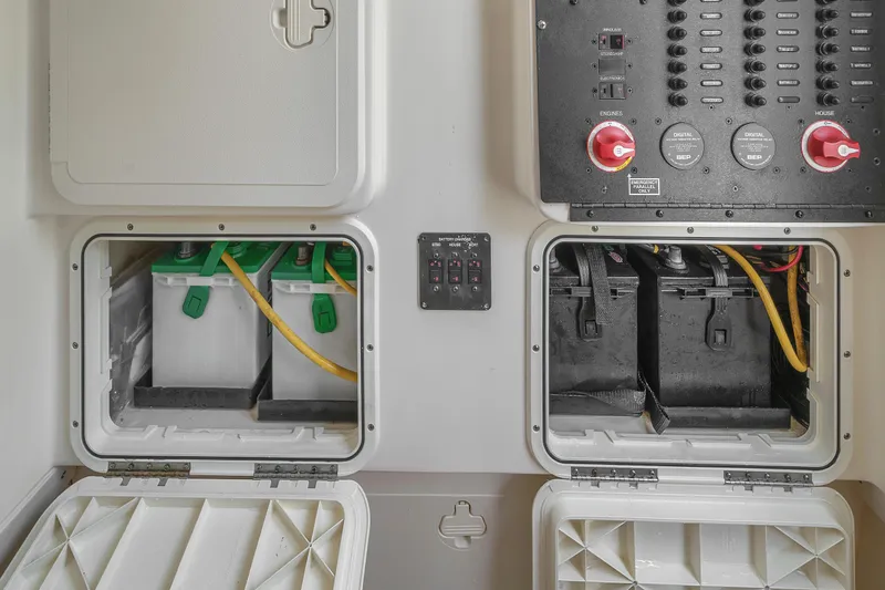 Slide: The Image of 2015 Scout 275 LXF boat battery compartment with control panel and wiring. - 39