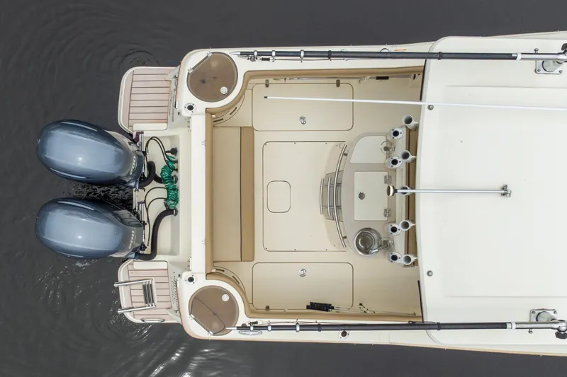 Slide: The Image of Overhead view of 2015 Scout 275 LXF boat with dual engines and fishing rod holders. - 6