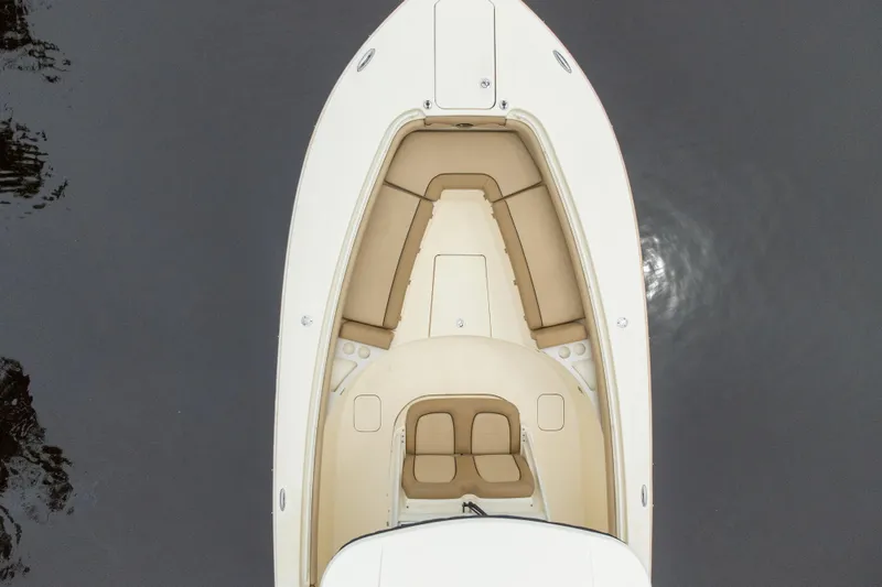 Slide: The Image of Overhead view of 2015 Scout 275 LXF boat with beige seating on water. - 7