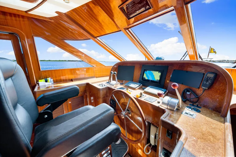 Slide: The Image of Luxurious 2007 Hampton 558 Pilothouse yacht interior with navigation controls and panoramic view. - 17