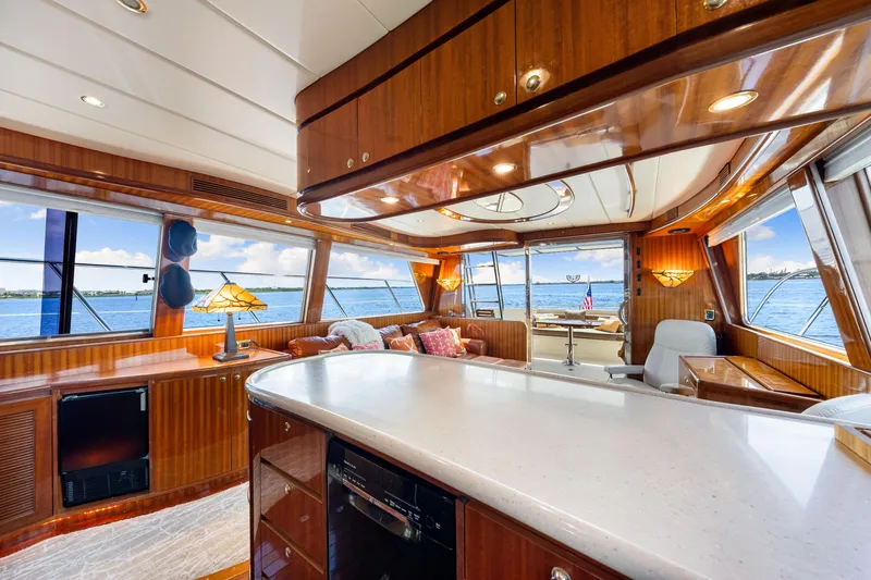 Slide: The Image of Luxurious interior of 2007 Hampton 558 Pilothouse yacht with panoramic ocean views. - 29