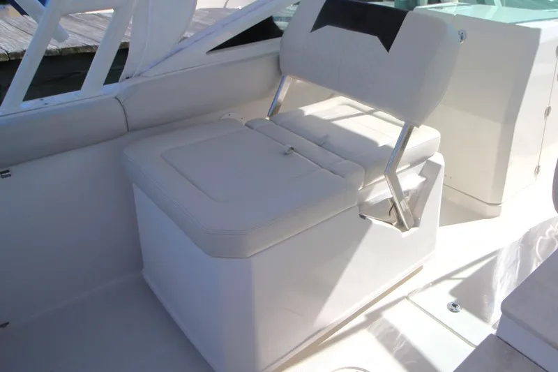 Slide: The Image of 2023 Sailfish 276 DC boat seat with white cushioned design and sleek finish. - 12
