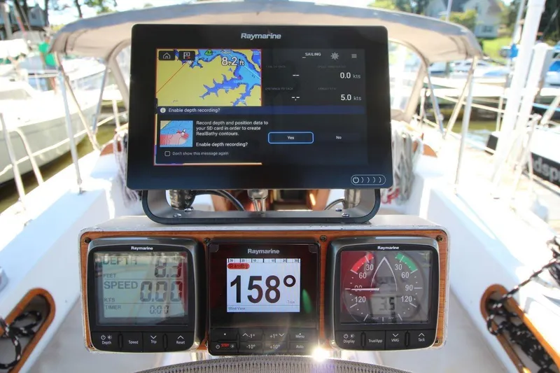 Slide: The Image of Cockpit of 1988 Catalina 34 sailboat with Raymarine navigation displays. - 15
