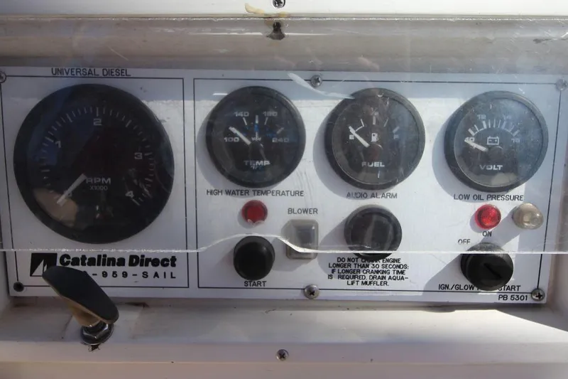 Slide: The Image of Control panel of a 1988 Catalina 34 sailboat with gauges and switches. - 16