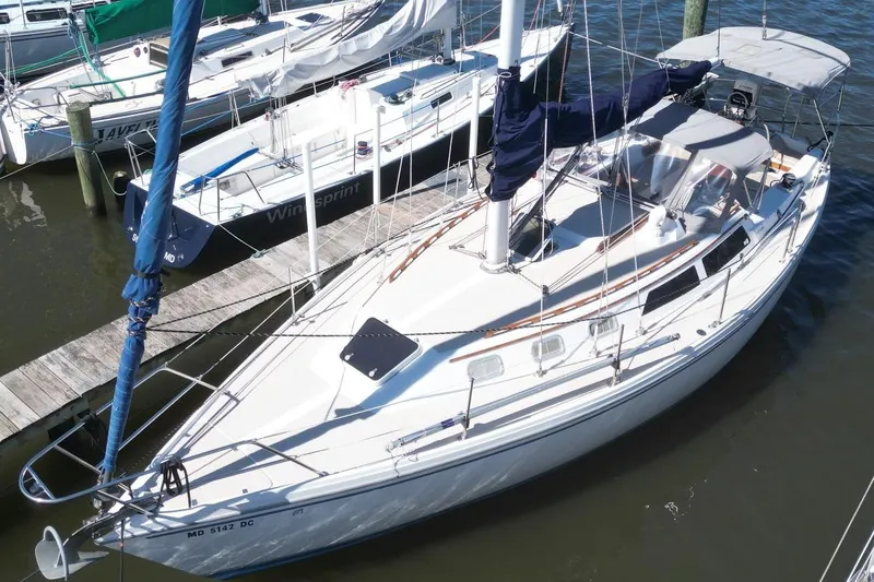 Slide: The Image of 1988 Catalina 34 sailboat docked at marina, viewed from above. - 5