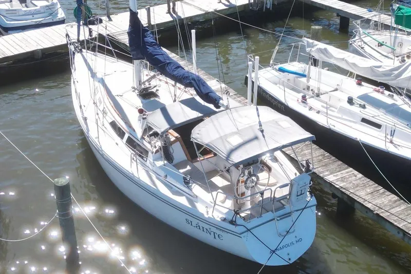 Slide: The Image of 1988 Catalina 34 sailboat docked at marina, aerial view. - 7