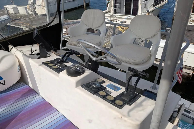 Slide: The Image of 1992 Luhrs Tournament 320 Convertible helm with dual seats and control panel. - 11