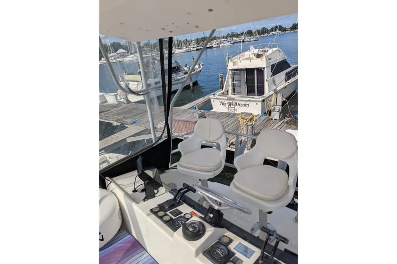 Slide: The Image of 1992 Luhrs Tournament 320 Convertible boat cockpit with dual seats and control panel. - 14