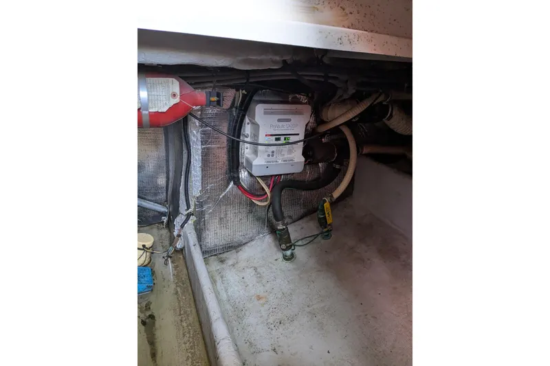 Slide: The Image of 1992 Luhrs Tournament 320 Convertible engine room with wiring and equipment. - 30