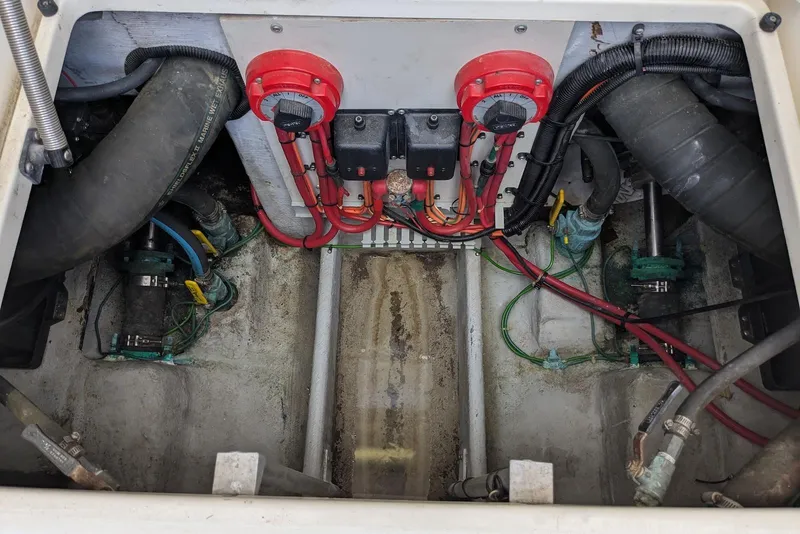 Slide: The Image of Engine compartment of a 1992 Luhrs Tournament 320 Convertible boat, showing wiring and components. - 31