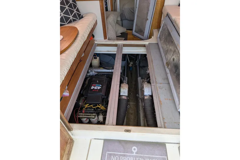 Slide: The Image of Engine compartment of 1992 Luhrs Tournament 320 Convertible boat, showcasing mechanical components. - 33