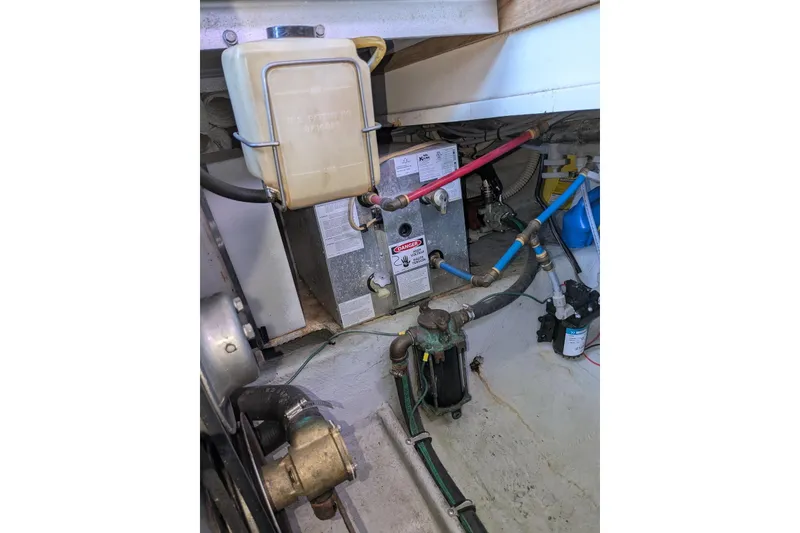 Slide: The Image of Engine room of 1992 Luhrs Tournament 320 Convertible with visible components and wiring. - 34