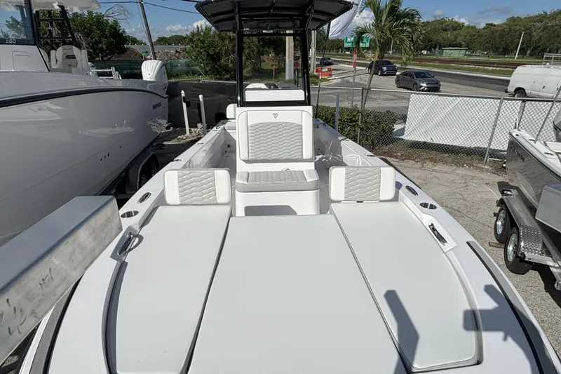Slide: The Image of 2026 Twin Vee 22 Bay Cat boat with spacious seating and modern design. - 6