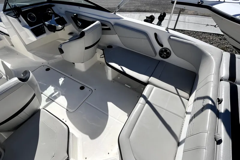 Slide: The Image of 2021 Sea Ray SPX 210 Outboard boat interior with spacious seating and modern design. - 10