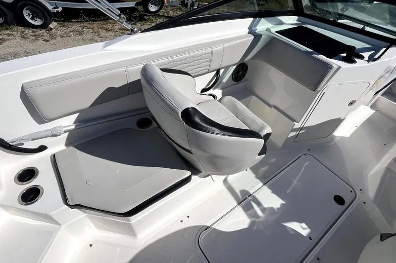 Slide: The Image of 2021 Sea Ray SPX 210 Outboard boat interior with sleek seating and modern design. - 15