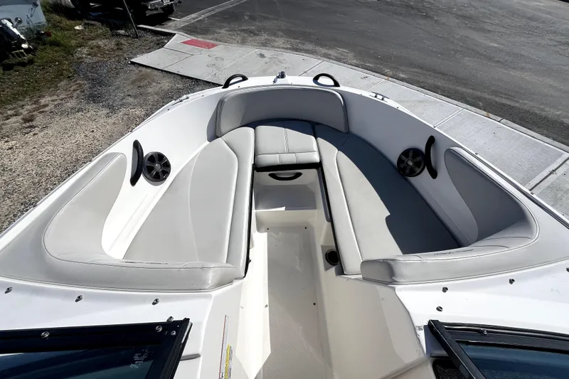 Slide: The Image of 2021 Sea Ray SPX 210 Outboard boat interior with spacious seating and modern design. - 24