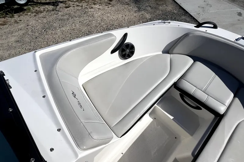 Slide: The Image of 2021 Sea Ray SPX 210 Outboard boat interior with gray seating and speaker. - 25