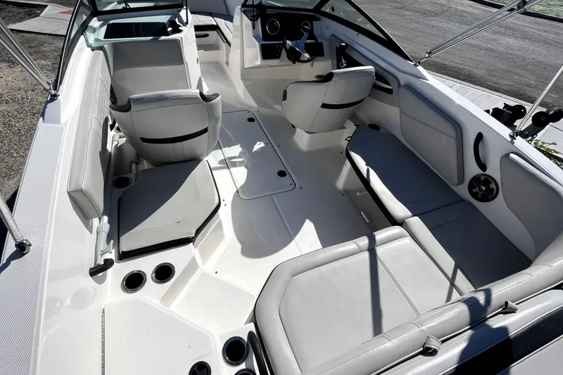 Slide: The Image of Interior view of 2021 Sea Ray SPX 210 Outboard boat with seating and steering console. - 9
