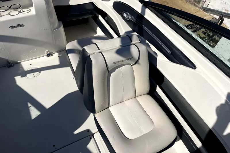 Slide: The Image of Interior of 2012 Sea Ray 205 Sport boat with white seating. - 8