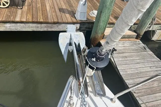 Slide: The Image of 2017 Beneteau Oceanis 38.1 sailboat with blue canopy docked at marina. - 14