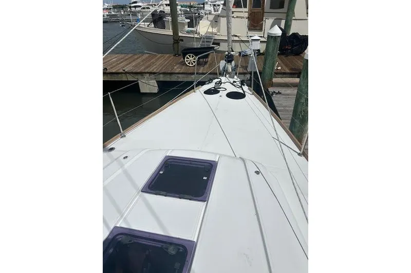Slide: The Image of 2017 Beneteau Oceanis 38.1 yacht cockpit with wooden deck and steering wheel. - 20