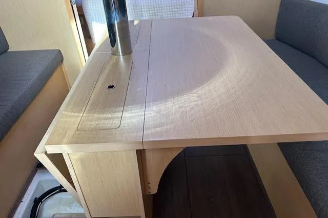 Slide: The Image of 2017 Beneteau Oceanis 38.1 sailboat docked, featuring dual steering wheels and spacious cockpit. - 27