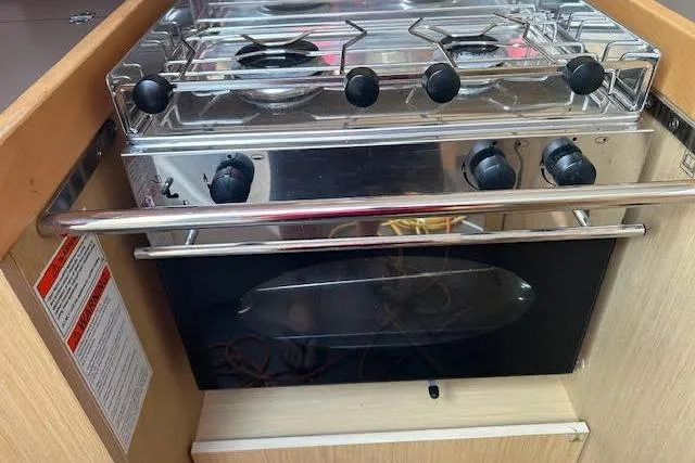 Slide: The Image of Compact bathroom in 2017 Beneteau Oceanis 38.1 yacht with modern fixtures and mirror. - 32