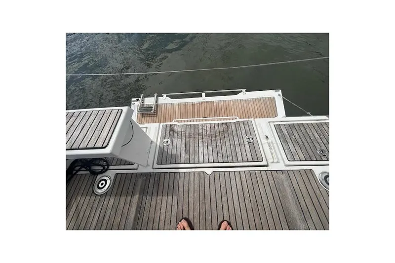 Slide: The Image of 2017 Beneteau Oceanis 38.1 sailboat docked at marina with dual steering wheels. - 34