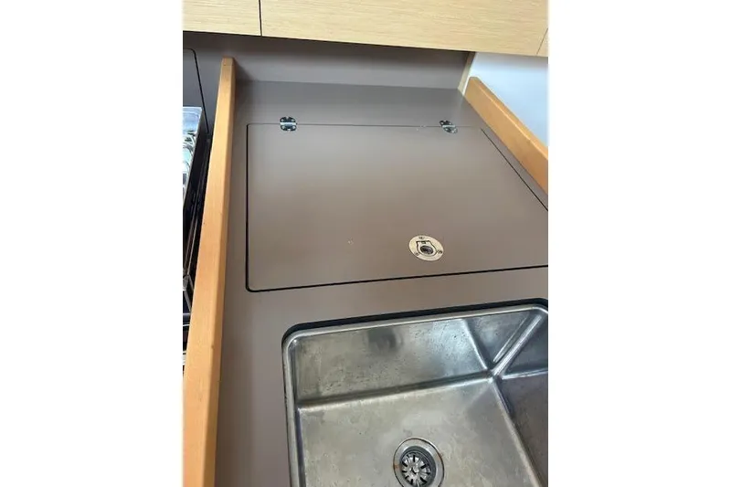 Slide: The Image of Engine compartment of a 2017 Beneteau Oceanis 38.1 sailboat, showcasing mechanical components. - 7