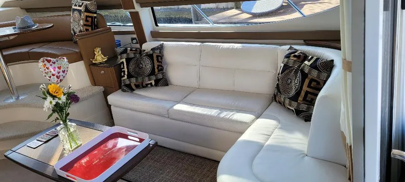 Slide: The Image of Luxurious interior of 2016 Meridian 391 Sedan with white leather seating and decorative pillows. - 10