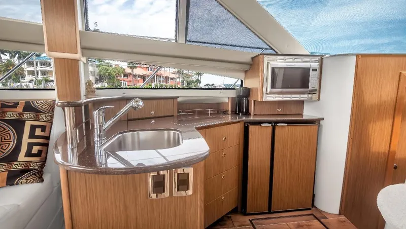Slide: The Image of Interior of 2016 Meridian 391 Sedan yacht with modern kitchen amenities. - 16