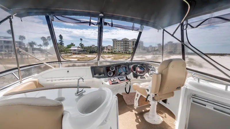 Slide: The Image of 2016 Meridian 391 Sedan yacht cockpit with modern controls and panoramic view. - 23