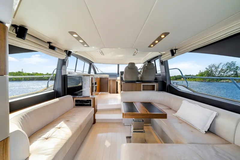 Slide: The Image of Luxurious interior of 2018 Azimut 50 Fly yacht with elegant seating and scenic water views. - 15
