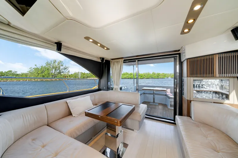 Slide: The Image of Luxurious interior of 2018 Azimut 50 Fly yacht with elegant seating and scenic water view. - 18
