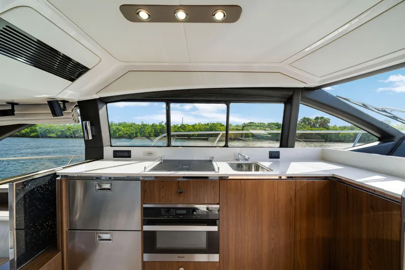 Slide: The Image of Luxurious kitchen interior of 2018 Azimut 50 Fly yacht with modern appliances and scenic view. - 20